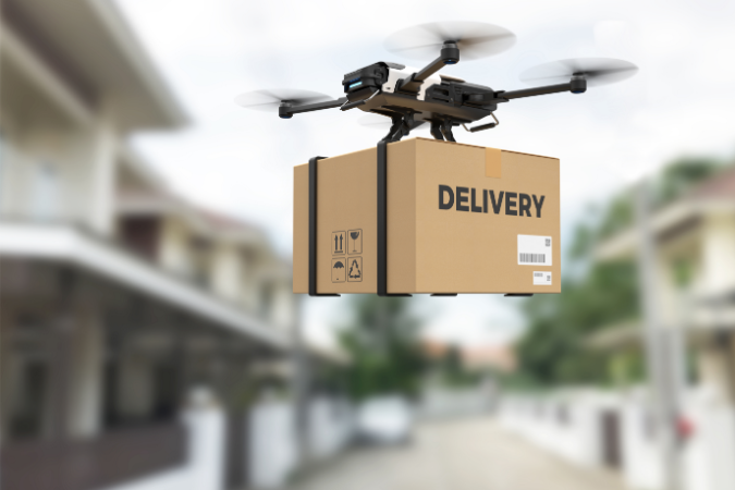 A flying Drone holding a box marked delivery as it makes a contactless car key delivery